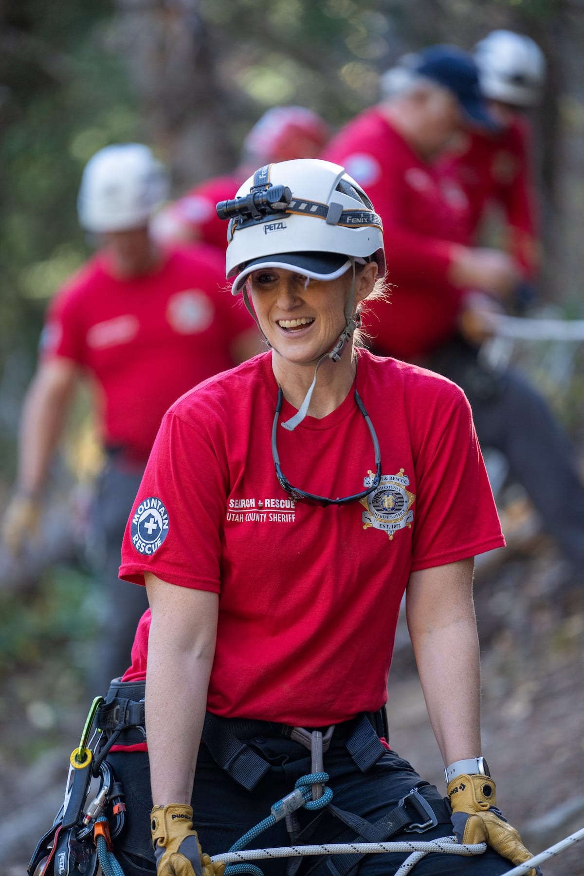 Utah County Sheriff Search and Rescue volunteers crossing rocky terrain